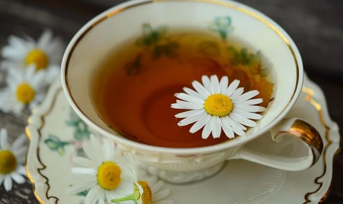 chamomile tea in cup on table